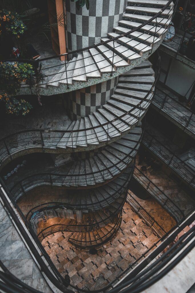 Stunning high angle view of a spiral staircase with intricate architectural design.